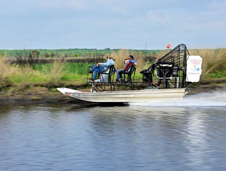 Family on an airboat on St John’s river in Florida