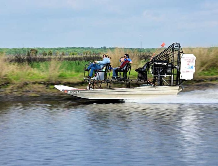 Family on an airboat on St John’s river in Florida