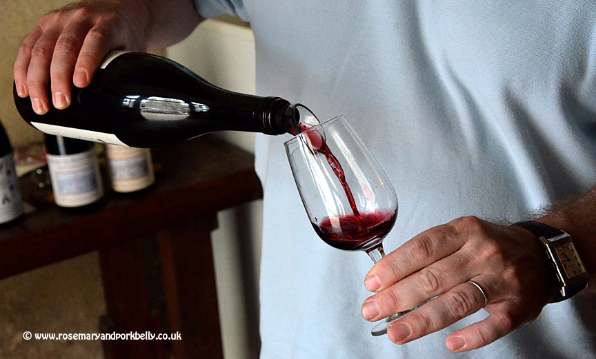 French vineyard owner pouring wine to taste