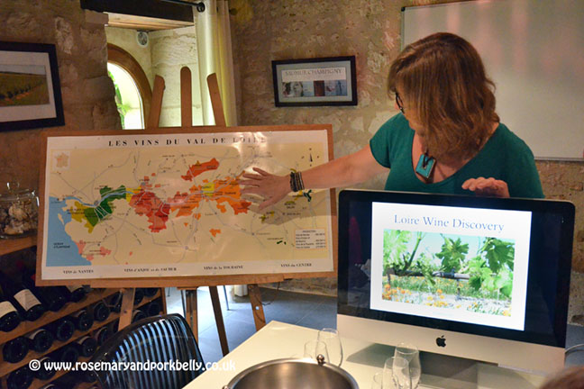 Kathy showing the wine map of the Loire - Le Tasting Room CumerayFrance