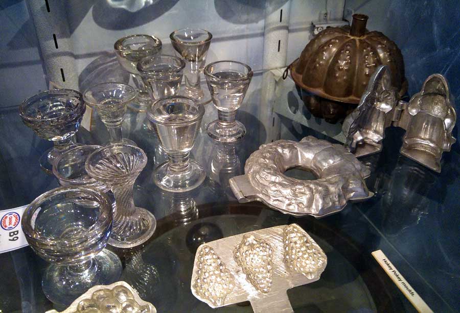 Glass penny licks and metal ice cream moulds at London Canal Museum. Banned in London in 1898 