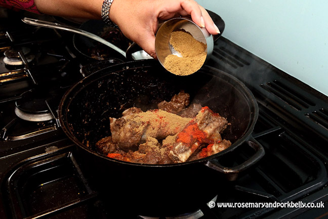 Adding spices to the qorma