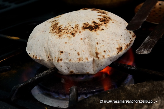 Puffing up the freshly made phulka