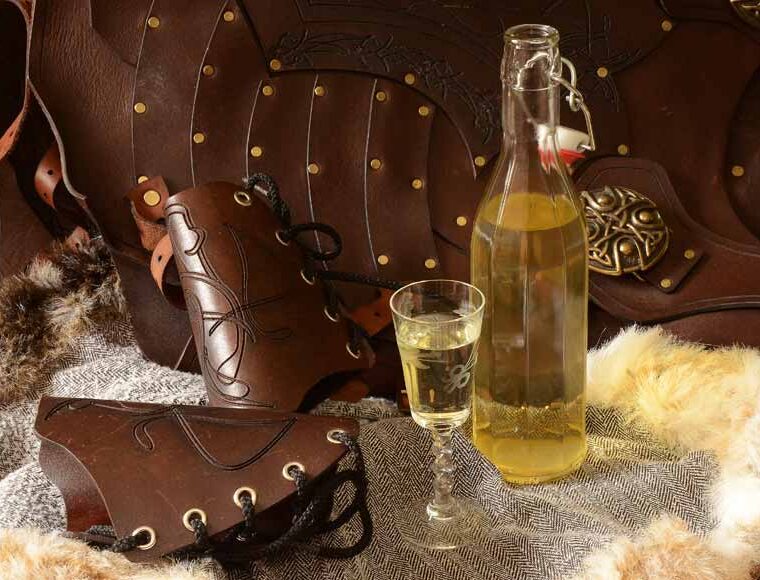 Bottle and glass of English Mead and leather armour