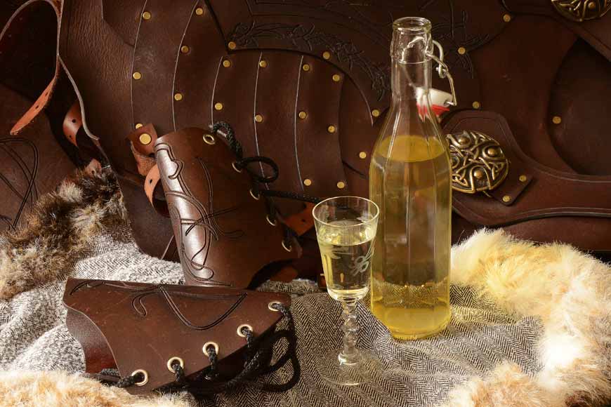 Bottle and glass of English Mead and leather armour