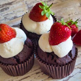 3 Devil's Food Muffins with white chocolate icing and strawberries
