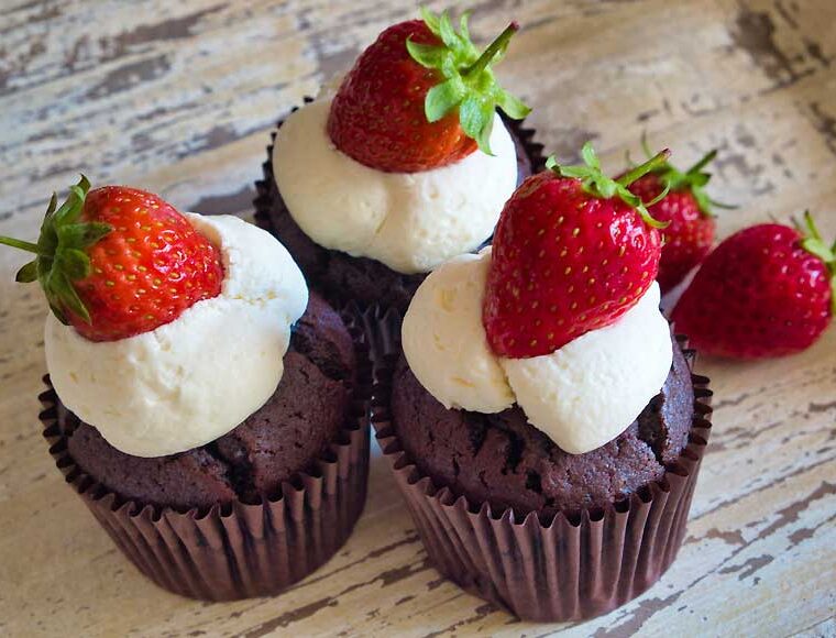 3 Devil's Food Muffins with white chocolate icing and strawberries