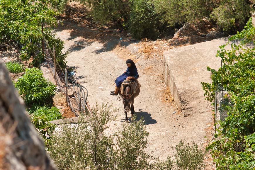 Woman riding a donkey, Crete © rosemaryandporkbelly.co.uk