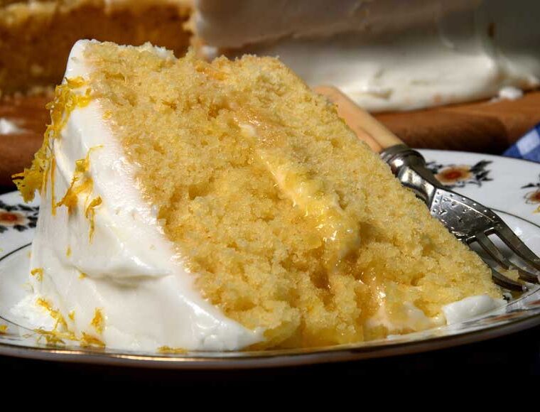 A slice of lemon cheesecake cake