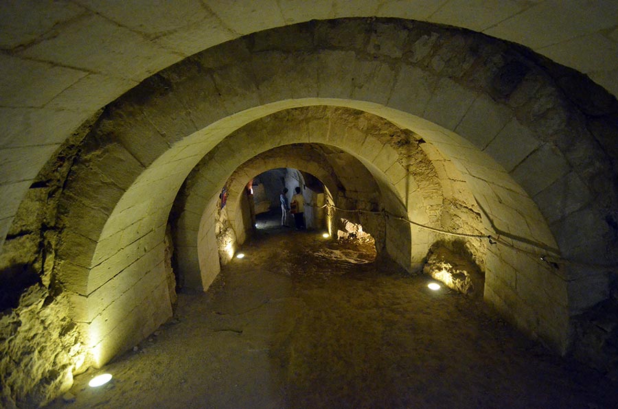 Walking the underground passages at Château de Brézé, Loire France