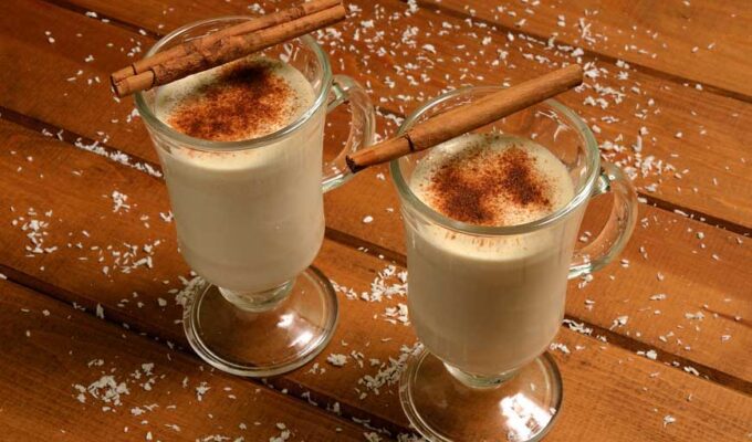 2 glasses of dairy free coconut milk eggnog served with cinnamon