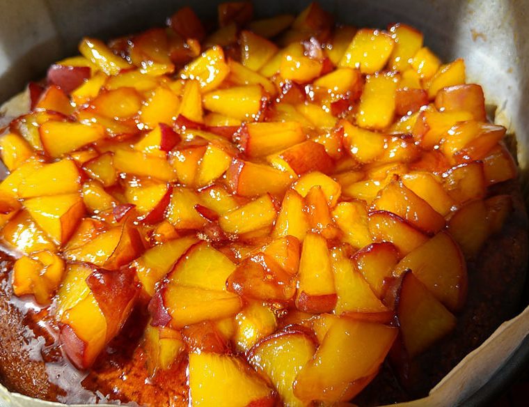 Peach Schnapps cake topped with caramelised peaches
