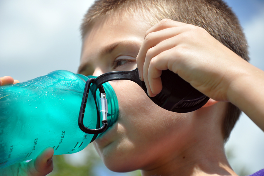 Drinking from a refillable water bottle