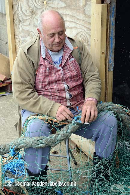 Whitstable fisherman mending his nets - Kent