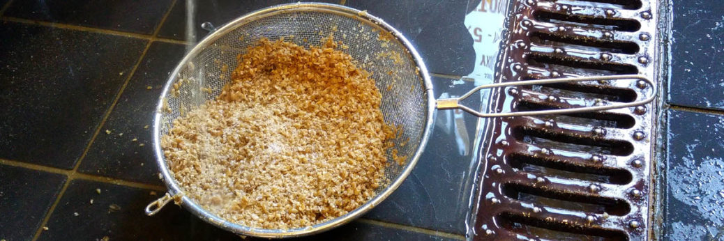 Cleaning out sticky grains from the mash tun, brewing beer © rosemaryandporkbelly
Brewer for a day
