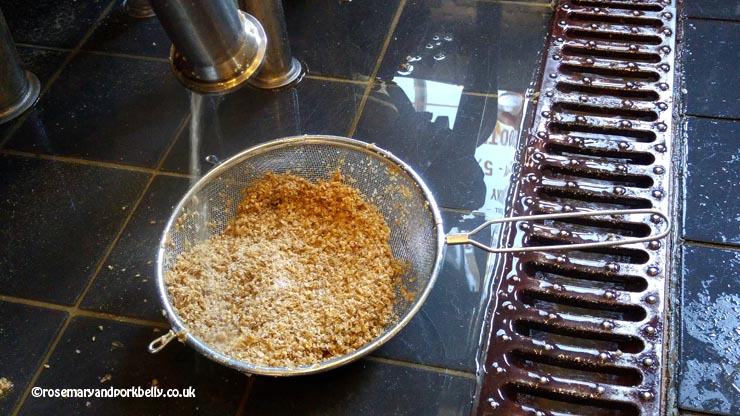 Cleaning out sticky grains from the mash tun © rosemaryandporkbelly.co.uk