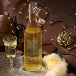 Bottle and glass of English Mead with leather armour
