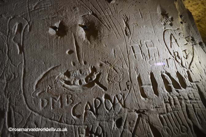 Carvings in the sandstone, Tunnel Road West Reigate Caves © rosemaryandporkbelly.co.uk