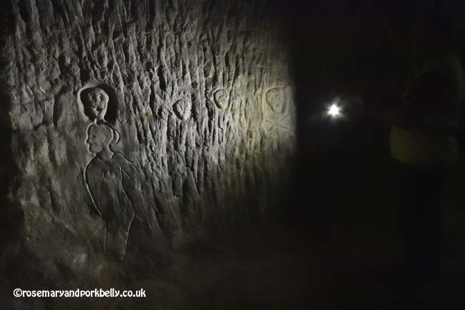 Carvings on the sandstone walls, Tunnel Road West Reigate Caves © rosemaryandporkbelly.co.uk