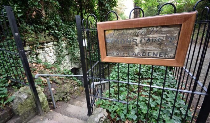 Railings and stone steps leading to Baron's Cave Reigate Surrey UK