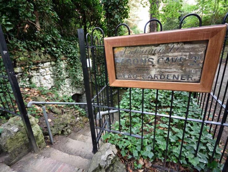 Railings and stone steps leading to Baron's Cave Reigate Surrey UK