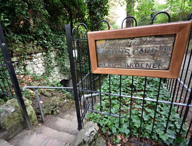 Railings and stone steps leading to Baron's Cave Reigate Surrey UK
