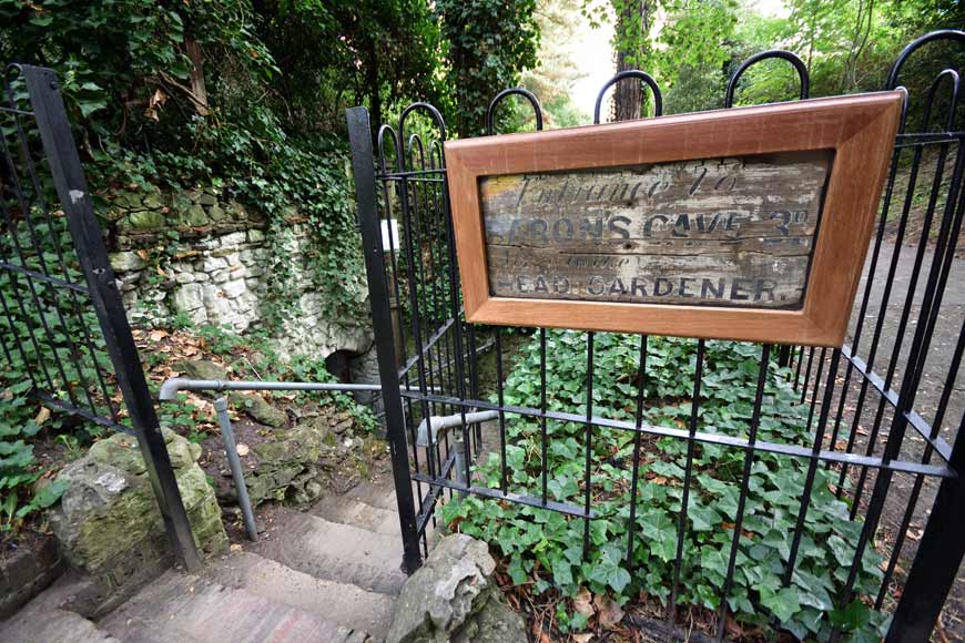 Railings and stone steps leading to Baron's Cave Reigate Surrey UK