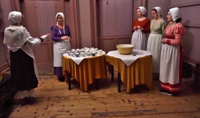 Servants being given instructions at 'Dine Like a Servant' taking place at The Regency Town House in Hove UK