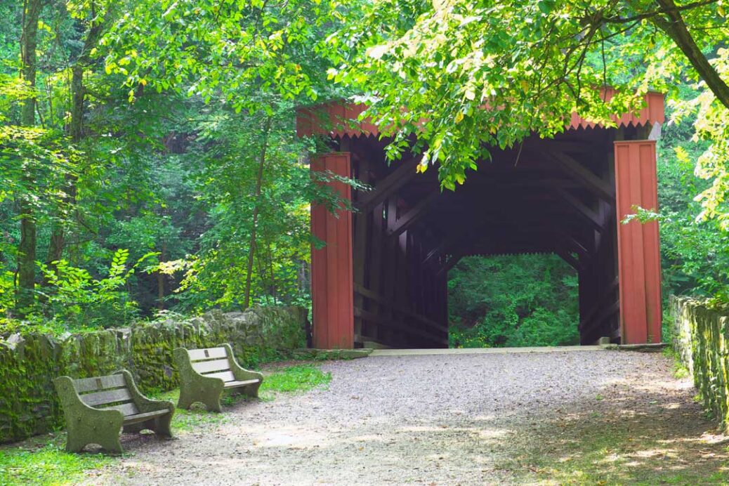 Thomas Mill Bridge the red covered bridge in Wissahickon Valley Park Philadelphia USA. Originally built in 1737 the only remaining covered bridge in the Wissahickon