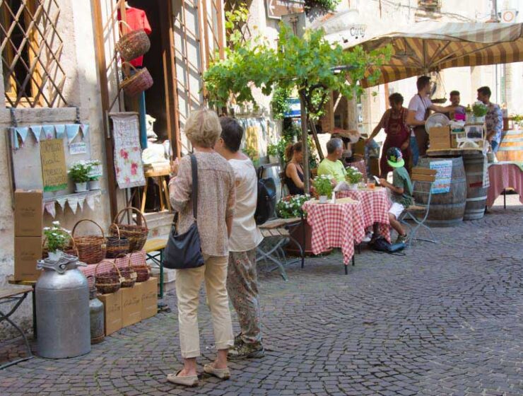 2 People looking at restaurant menu outside restaurant in Asolo, Veneto Italy