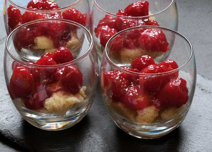 Raspberries, jam and sponge cake for trifle