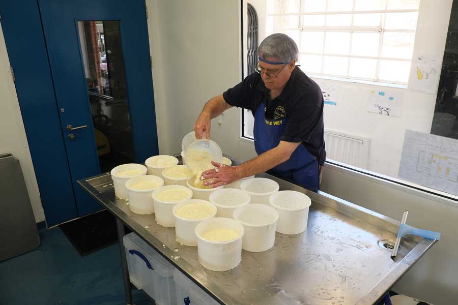 Filling the moulds with the curds Cheese On The Wey