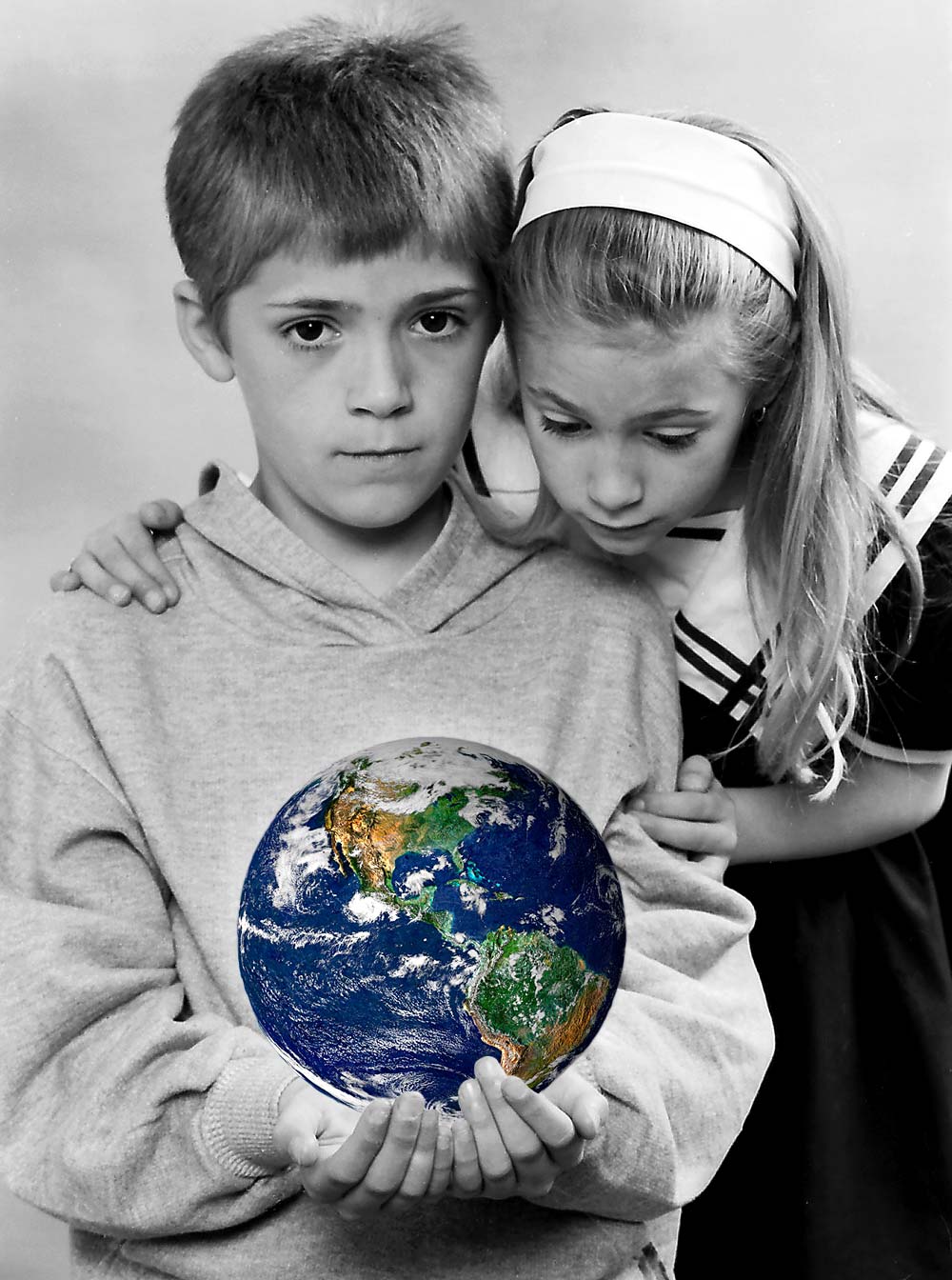 2 children holding the world