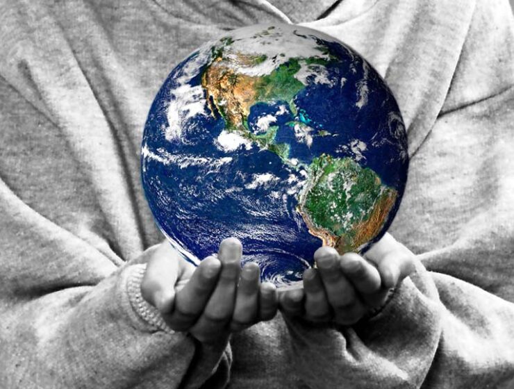 Child holding the world in their hands