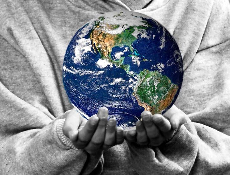 Child holding the world in their hands