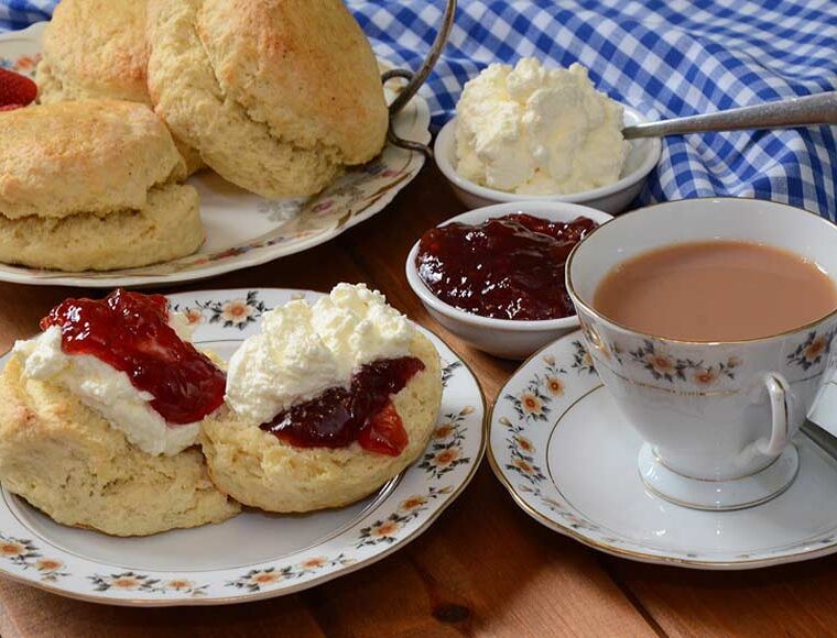 Afternoon tea with scones strawberry jam and cream