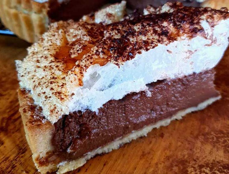 Dairy free chocolate cream pie with a pastry base and meringue topping