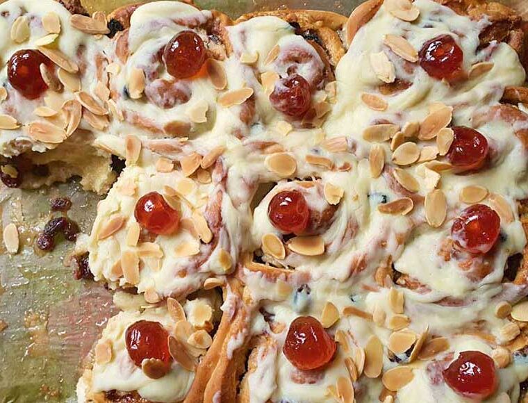 Simnel sticky buns. Made from an enriched dough with the addition of marzipan and a white chocolate ganache icing