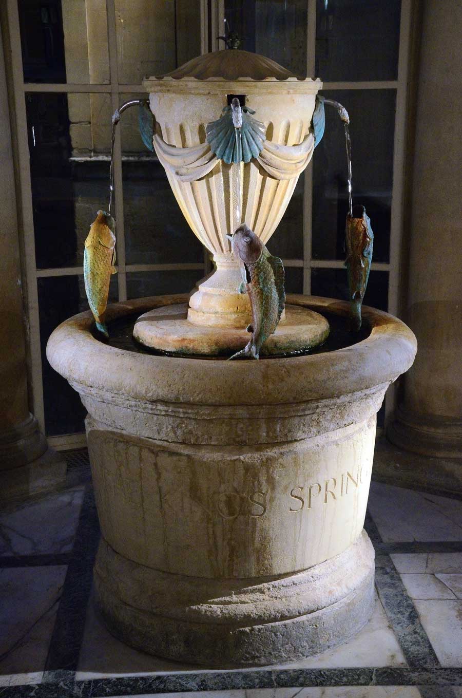 Fountain dispensing Bath spa water in the Pump Room in Bath, Somerset, UK