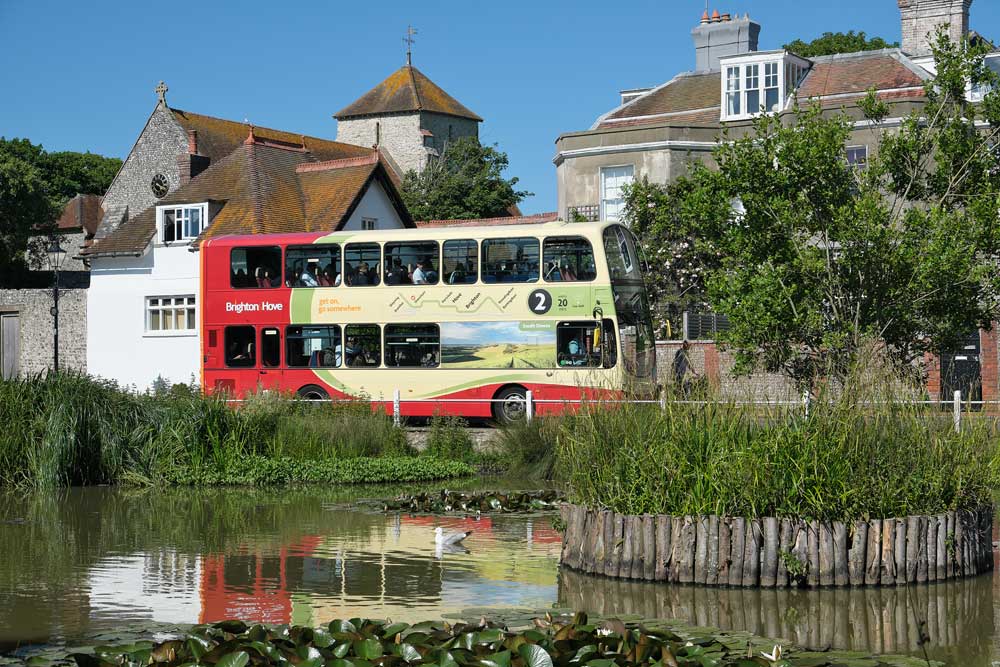 Brighton and Hove number 2 bus passing the village pondRottingdean East Sussex