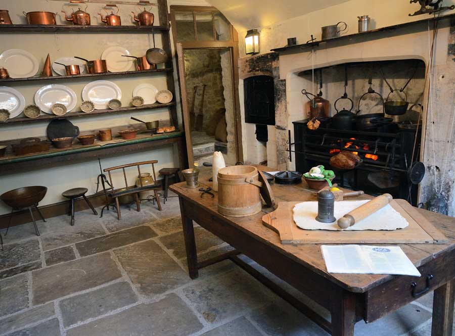 Kitchen showing Regency utensils and cooking range at No1 Royal Crescent in Bath, UK