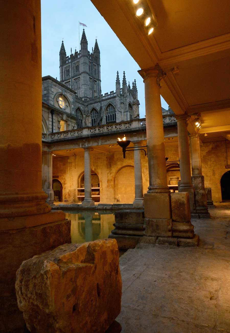 Bath Abbey viewed from The Roman Baths at twilight in Bath, Somerset, UK