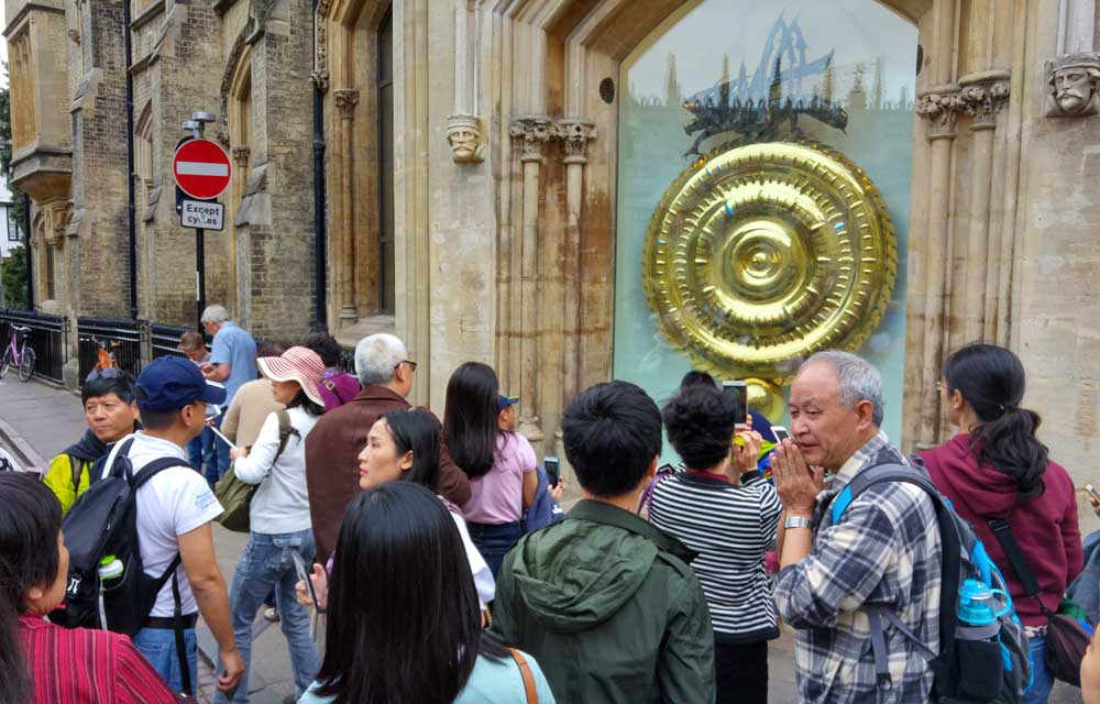 Crowds around the Corpus Clock, Corpus Christi College, Cambridge UK
