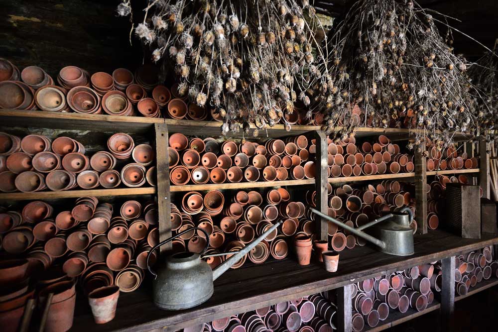 Flowerpots inside the potting shed at The Lost Gardens of Heligan, Cornwall