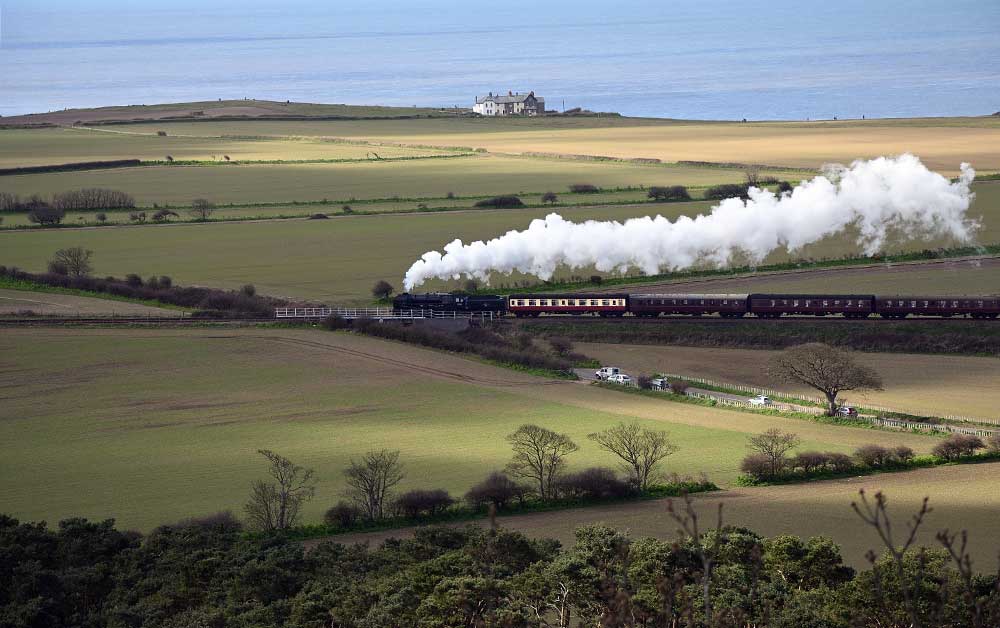 Standard Class 4, 2-6-0 steam train on The North Norfolk Railway Poppy Line near Sheringham Norfolk