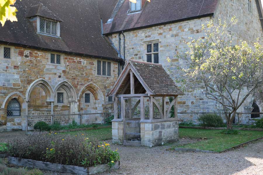 Cloister garden and well at Michelham Priory, the site of a former Augustine Priory in Upper Dicker, East Sussex UK