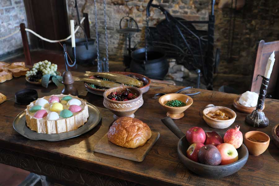 Replica Tudor food laid out on table at Michelham Priory a former Augustine Priory in Upper Dicker, East Sussex UK