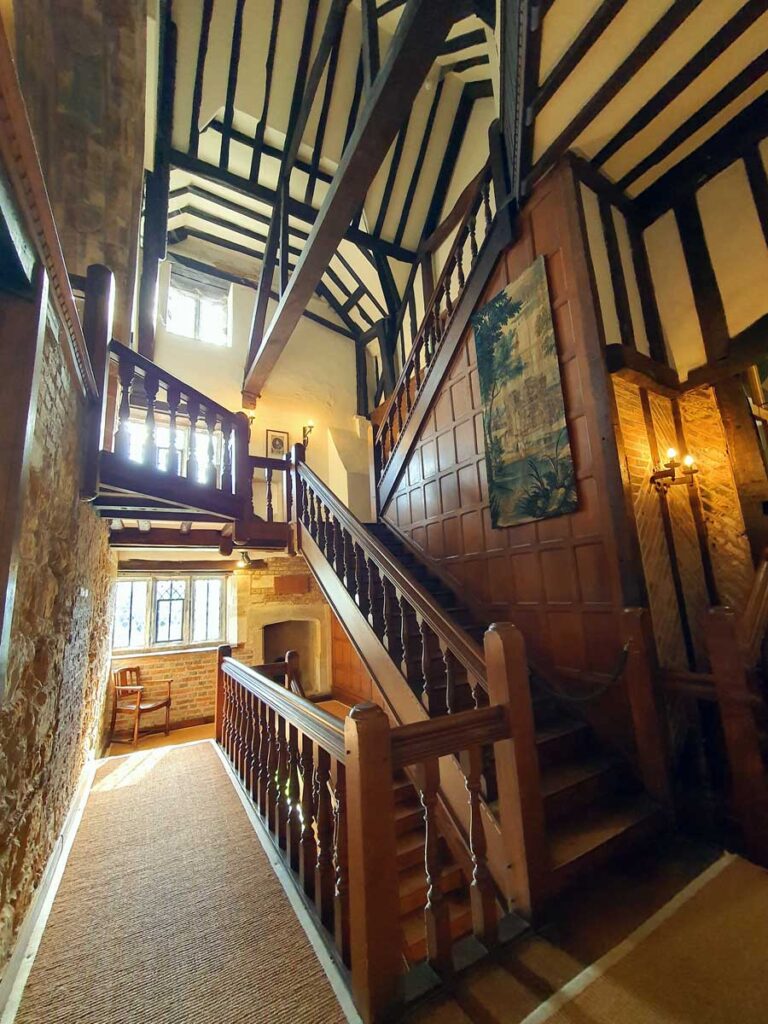 Wooden staircase and panelling at Michelham Priory, the site of a former Augustine Priory in Upper Dicker, East Sussex UK