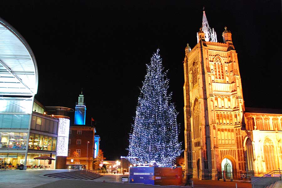 The forum, city hall, Christmas tree and St Peter Mancroft church at night, Norwich, Norfolk, UK