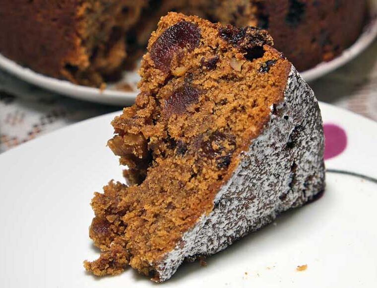 Slice of vegan cherry and walnut mincemeat fruitcake
